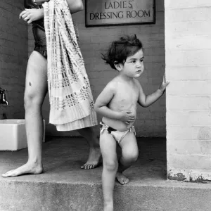 Two year old Judith Fisher comes out of the ladies dressing room to go for a swim Two year old Judith Fisher comes out of the ladies dressing room to go for a swim