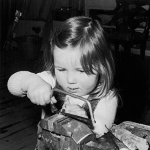 Three year old Pamela Murray working in her dads Silversmiths workshop in Glenrothes