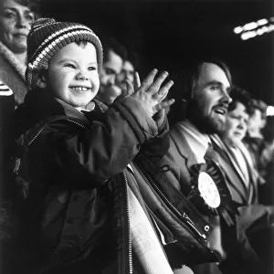 Three year old Terry Morris watching Manchester United with his dad in the grandstand