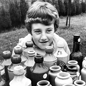 Ten year old Tracy Milles looks after her dads bottle stall