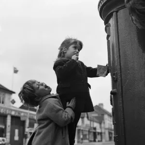 Two four year olds making sure that Father Christmas gets that letter in time Two four year olds making sure that Father Christmas gets that letter in time