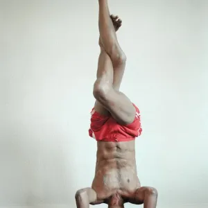 Yoga positions. Position is called Eagle in Tripod Headstand Yoga positions. Position is called Eagle in Tripod Headstand