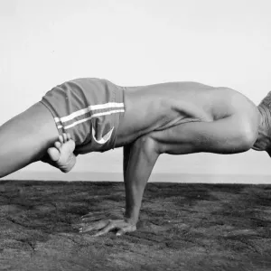 Yoga positions. Position is called Lotus in Peacock (Padma Mayurasana Yoga positions. Position is called Lotus in Peacock (Padma Mayurasana