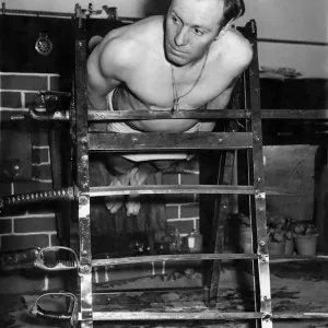 Yogi Special: Albert Buxton seen here balancing on swords. November 1953 P005252 Yogi Special: Albert Buxton seen here balancing on swords. November 1953 P005252