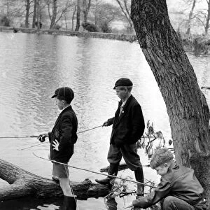 Three young anglers make for a picturesque picture as they fish at the Top Ponds