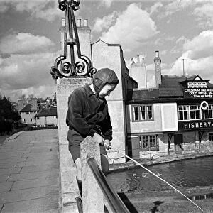 A young boy fishing in the Grand Union canal at Boxmoor, Hertfordshire. Circa 1945