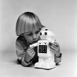 A Young Boy with Computer48 Toy Robot Print, December 1980
