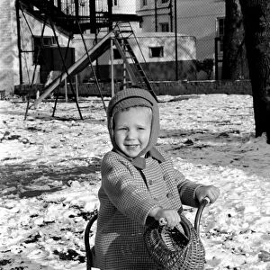 Young boy Robert playing on his bicycle in the snow. November 1969 Z11486