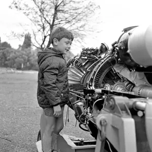 A young boy (unidentified) enjoys inspecting an engine at the RAF Display at Caversham A young boy (unidentified) enjoys inspecting an engine at the RAF Display at Caversham