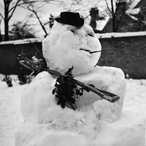 Two young boys from Dry Drayton, Cambridgeshire, take the opportunity of the heavy snow Two young boys from Dry Drayton, Cambridgeshire, take the opportunity of the heavy snow