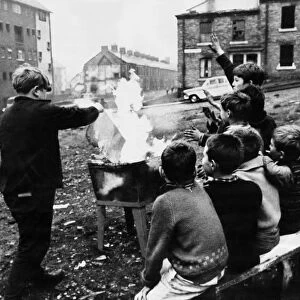 Young boys starting a fire in Beaumont Street, Newcastle Upon Tyne