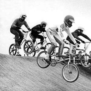 Young contestants over the obstacle in a BMX race at Windy Nook