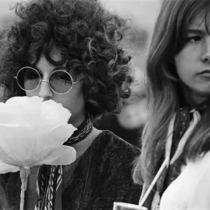 A young couple of females, with large flower and fashionable sunglasses at The Windsor A young couple of females, with large flower and fashionable sunglasses at The Windsor