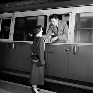 Young couple saying goodbye at train Station. Febuary 1953 D696