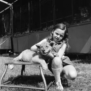 Young girl is a lion tamer, Teesside, Circa 1972 Young girl is a lion tamer, Teesside, Circa 1972
