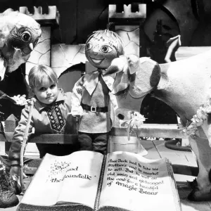 A young girl visiting a christmas grotto in Teesside, surrounded by characters from Jack A young girl visiting a christmas grotto in Teesside, surrounded by characters from Jack