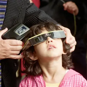 A young girl watching the solar eclipse in Chester. 11th August 1999