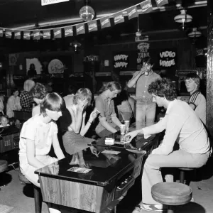 Young holidaymakers play the video machines at the James Corrigan seafront amusement
