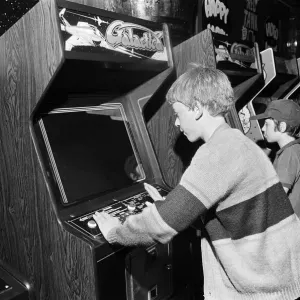 Young holidaymakers play the video machines at the James Corrigan seafront amusement