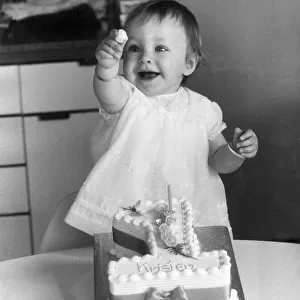 Young Kristen Bullen pictured showing of her cake at her home in Catford