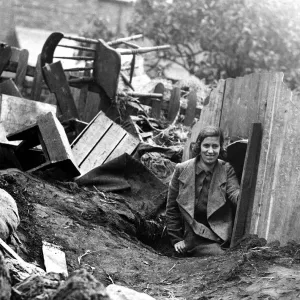 Young Lady Emerges from Anderson Shelter Print, Circa 1940 Young Lady Emerges from Anderson Shelter Print, Circa 1940