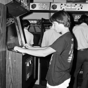Print of Young People Playing Video Games in a London Arcade, 1983 Print of Young People Playing Video Games in a London Arcade, 1983