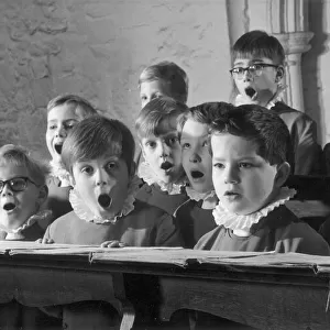 Young probationers at the Westminster Abbey School Choir sing a hymn during choir