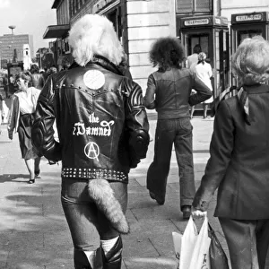A young punk rocker walking down Colmore Road, Birmingham