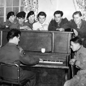 These young recruits liked to have a sing song round the piano in the N. A. A. F. I. club These young recruits liked to have a sing song round the piano in the N. A. A. F. I. club