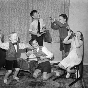 A young skiffle group playing their instruments. Left to right in front, Leslie Bennett A young skiffle group playing their instruments. Left to right in front, Leslie Bennett