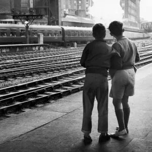 Young trainspotters at Paddington Station observing the locomotives. 26th May 1961