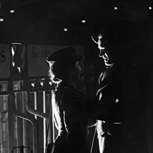 A young wartime couple say their goodbyes at the station as he returns to his army unit