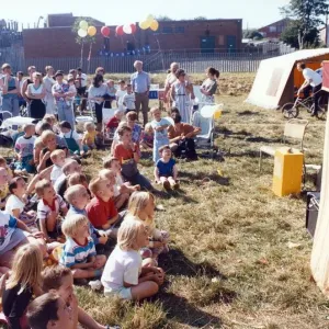 Youngsters are entertained by a Punch and Judy show at Carlin How carnival Youngsters are entertained by a Punch and Judy show at Carlin How carnival