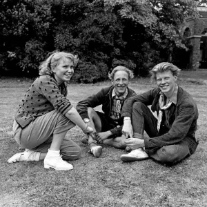 Youth Club. Three teenage friends enjoy sitting outdoors in the summer Youth Club. Three teenage friends enjoy sitting outdoors in the summer