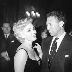 Zsa Zsa Gabor and Anthony Quayle at a reception at The Dorchester Hotel, London
