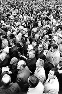 Mass Prints: Part of a 10, 000 strong congregation who braved torrential rain to take part in a Mass