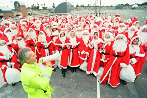 Megaphone Prints: 100 Father Christmas s, Photocall to open new multi storey carpark at Lakeside