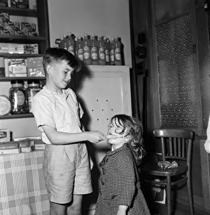 1000 ice lollies are given away free by sweet shop owner Mr H C Downey