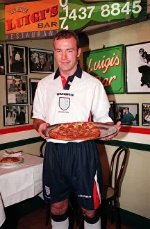 12 - ALAN SHEARER SHOWING OFF THE NEW 1997 ENGLAND KIT HOLDING A PIZZA