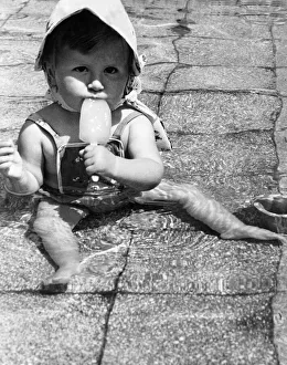Licking Prints: 14 month old Lynda Hall from Burgess Hill, Sussex, decided the only way to keep cool