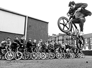 15 year old Martin Brunning in action on a BMX watched by other BMX kids