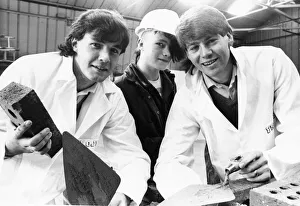 Apprentices Prints: 16 year old Peter Dodds (centre) watches soccer stars Wes Saunders (left