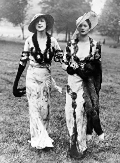 1930s Fashions Left: A gown of white crepe di chene patterned with large