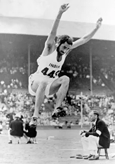 00015 Prints: 1948 London Olympic Games Baldev Singh of India competes in the Long Jump