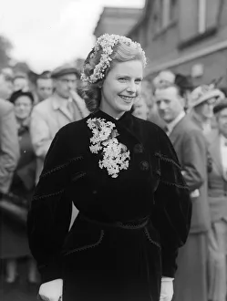 1953 Clothing Ascot Fashion. Lady Osborne wore a head-dress of flowers with a spray to