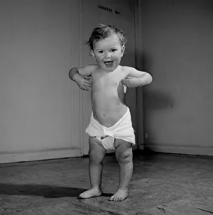 Shouting Prints: 1957 National Health Service Baby Clinic A 14 month baby toddles about the Baby