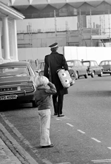 Upset Prints: 1975 Brighton Toy Fair. Small boy cries as Traffic Warden confiscate toy pedal car for