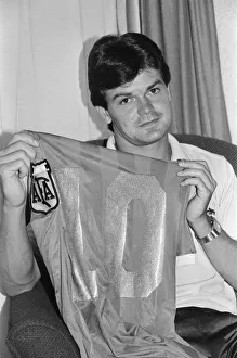 00245 Prints: 1986 World Cup Finals in Mexico. England footballer Steve Hodge holding the famous