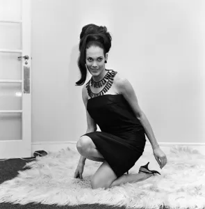 01189 Prints: 23-year-old Martine Beswick leaves London tonight for Rio where she will attend the Rio