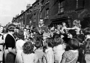 30 Year Old Pte Jim Kavangh of Edward Street Birmingham could not get home for VJ Day so